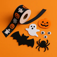 Halloween craft supplies with black ribbon, felt pumpkins, ghosts, bats, spiders, and googly eyes on an orange background—perfect for kids’ spooky DIY projects.