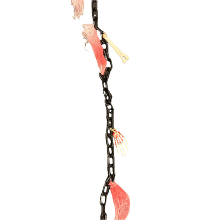 Black chain with pink leaves and a bone-like object on a textured gray background