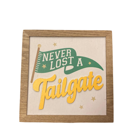 Celebrate it Never Lost a Tailgate Sign 7x7in