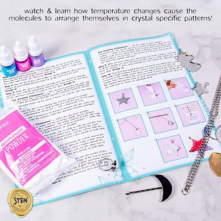 YOUniverse Crystal Growing Jewelry Kit instruction booklet with step-by-step guides, aluminum powder, coloring dyes, and jewelry pieces for crafting