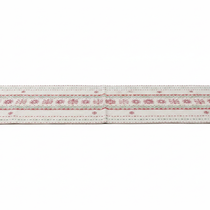 Cream fabric table runner with red and green Nordic Fair Isle snowflake pattern laid flat on white background