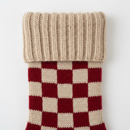 Close-up of red and white checkered knit Christmas stocking 18in showing knit texture