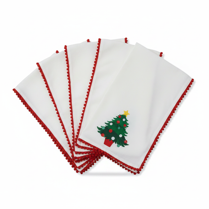 White cloth napkins with Christmas tree design and red crochet border, set of 4 on white background
