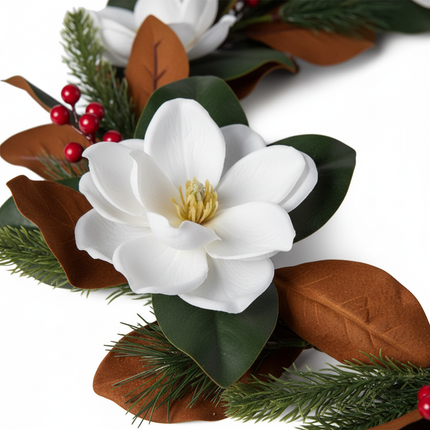 Close-up of Ashland white magnolia Christmas garland showing large white magnolia bloom detail with realistic petals and green leaves