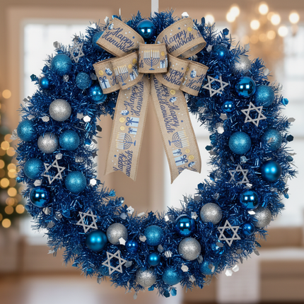 Celebrate It Happy Hanukkah wired burlap ribbon with menorah and dreidel motifs formed into a large bow on a Hanukkah wreath with blue and silver ornaments