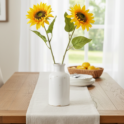 Ashland 28 inch dual golden yellow sunflower stem standing upright in a tall ceramic vase on a farmhouse dining table
