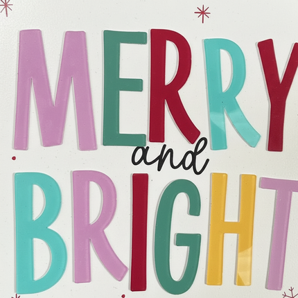 Close-up of colorful Merry and Bright lettering and candy stripe border with snowflake accents