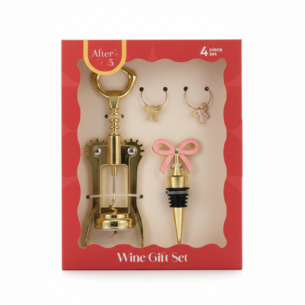 After 5 4-piece wine gift set in red packaging box with gold corkscrew, bottle stopper with pink bow, and wine glass charms on white background