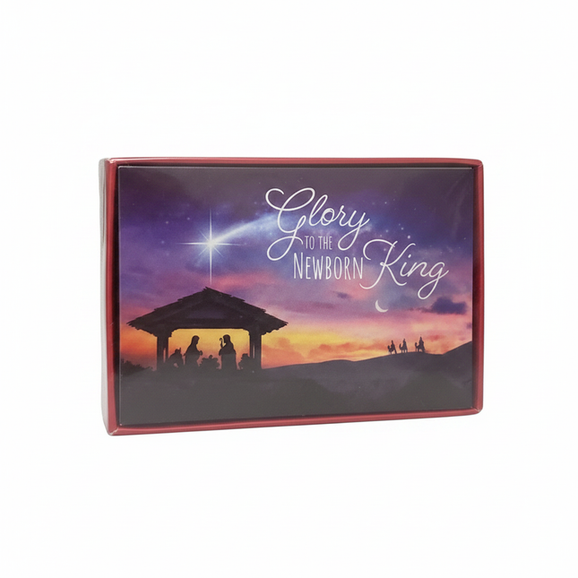 Glory to the Newborn King Christmas cards box front view showing Nativity silhouette and Star of Bethlehem on purple sunset sky, white background