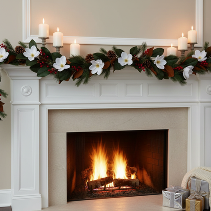 Ashland white magnolia Christmas garland 6ft draped along a fireplace mantel with white candles and pine cones