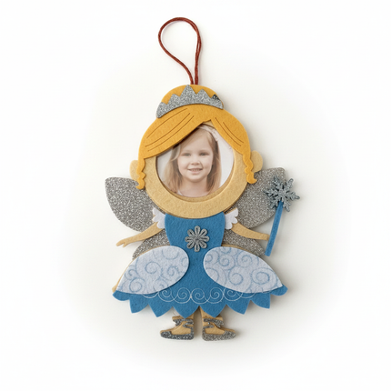 Close up detail of felt blonde fairy ornament silver glitter wings and snowflake brooch