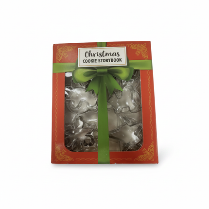 Celebrate It Christmas Cookie Storybook set in a red gift box with green bow containing 12 metal Christmas cookie cutters on white background