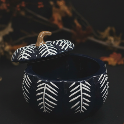 Close up of Celebrate It navy blue pumpkin-shaped ceramic bowl showing elegant glaze texture and black and white striped leaf detail