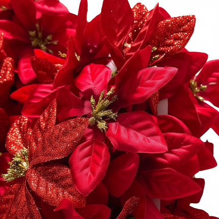 Close-up of Ashland red poinsettia chain garland showing lush red poinsettia flower detail with gold glitter stamens
