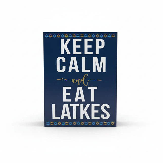 Navy blue wooden tabletop block sign reading Keep Calm and Eat Latkes on white background