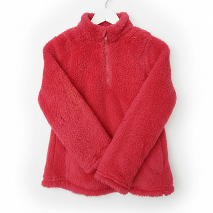 Girls red fuzzy fleece 1/4 zip pullover sweater hanging on a white wooden hanger against a white wall