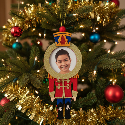 Studio Decor Felt Nutcracker Photo Ornament hanging on decorated Christmas tree