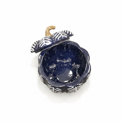 Celebrate It navy blue pumpkin-shaped ceramic bowl with black and white striped leaves and tan stem on white background