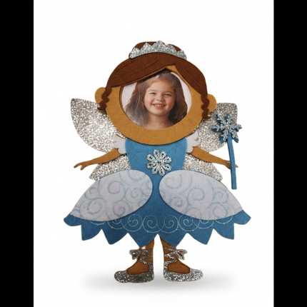 Close up detail of felt brown hair fairy ornament silver glitter wings and snowflake brooch