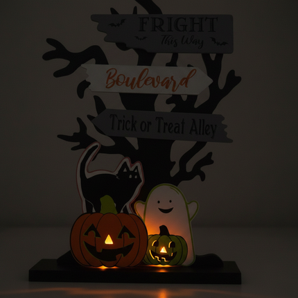Close-up of Ashland electric Halloween tabletop decor 6.25 inch showing light glow and Halloween figure detail