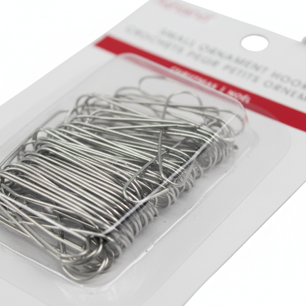 Close-up of silver Christmas ornament hooks showing metallic S-hook detail on white background