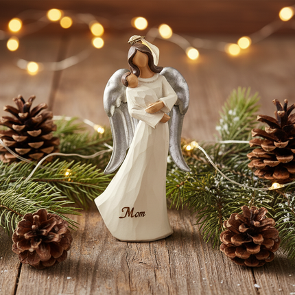 St Nicholas Square Mom Angel ornament displayed with pine branches and pinecones