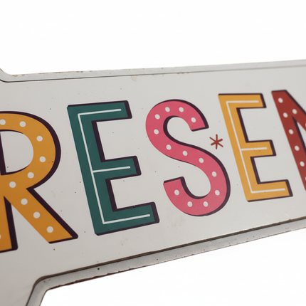Close-up of Ashland tabletop Christmas decor sign showing text and design detail