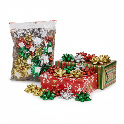 Celebrate It Christmas metallic star bows in assorted colors on wrapped gift boxes on white background