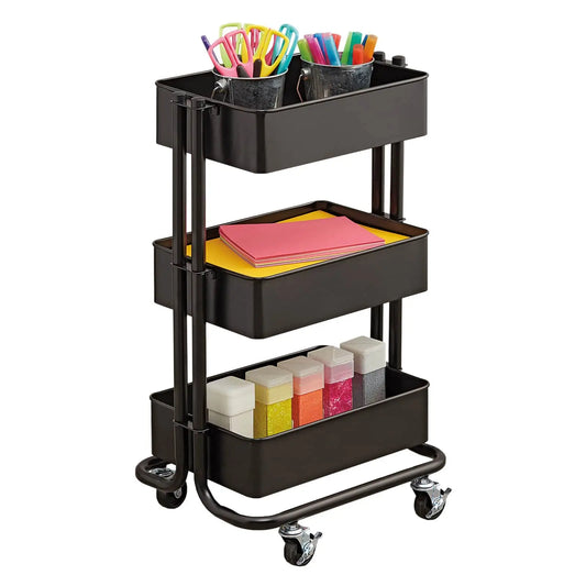 Black Simply Tidy Lexington Mini Rolling Cart with 3 mesh trays, wheels, and organized craft supplies like scissors, paper, and glitter containers.